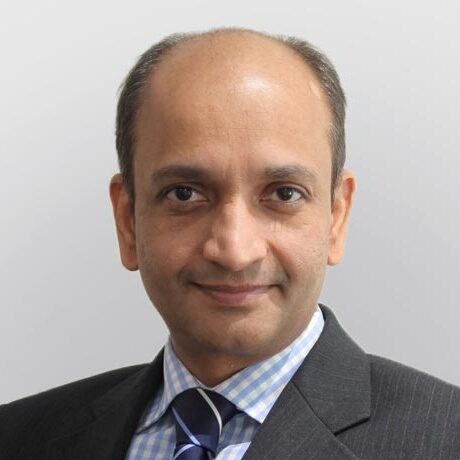 A middle aged male in suit