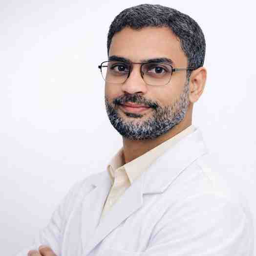 Indian doctor in White apron