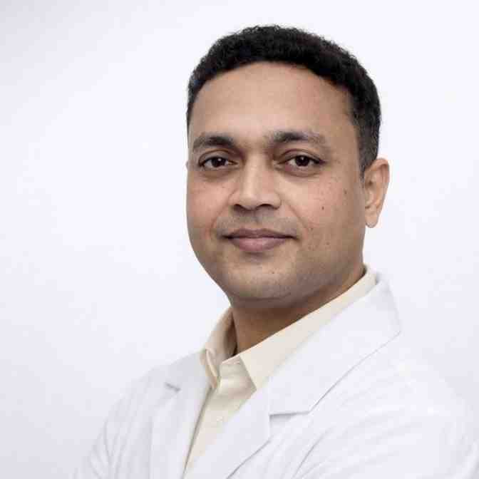 Indian doctor in white apron