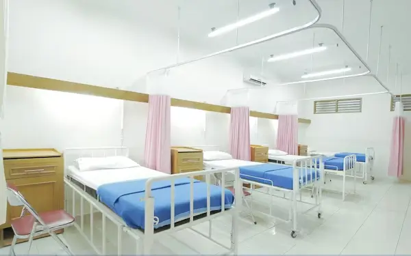 Hospital administrative staff managing patient bed allocation and healthcare coordination at Nishat Hospital