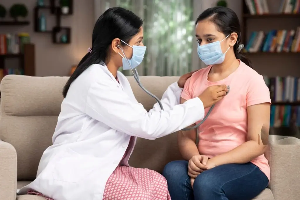 Doctor providing home medical consultation
