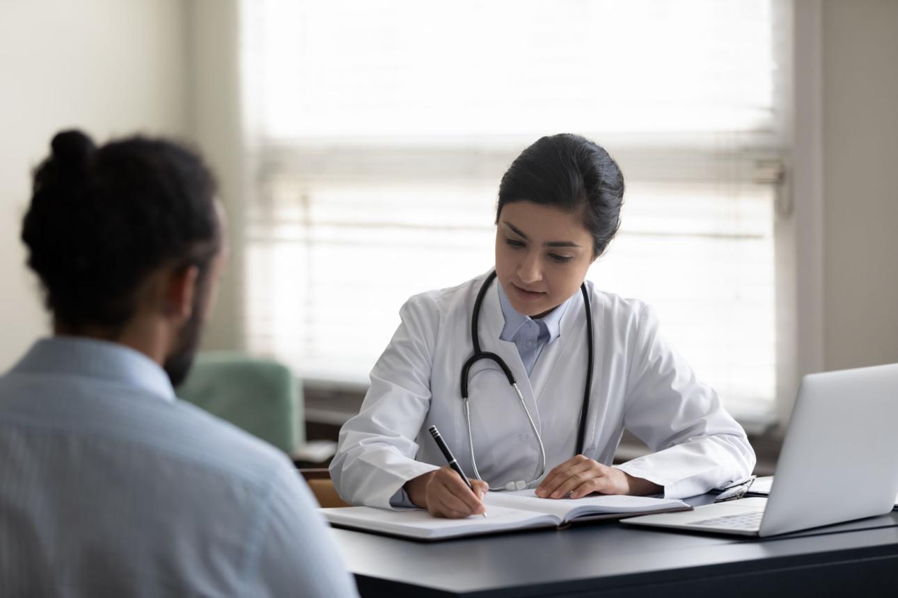 Doctor providing general consultation to patient at Nishat Hospital healthcare clinic