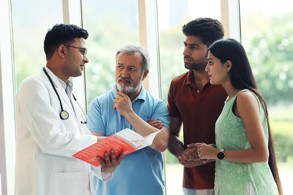 Multidisciplinary medical team discussing patient treatment in multispecialty hospital clinic