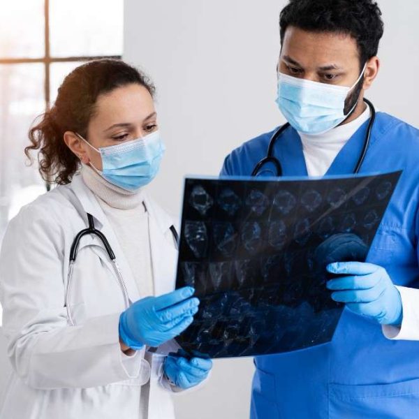 Two doctors discussing neuro X ray